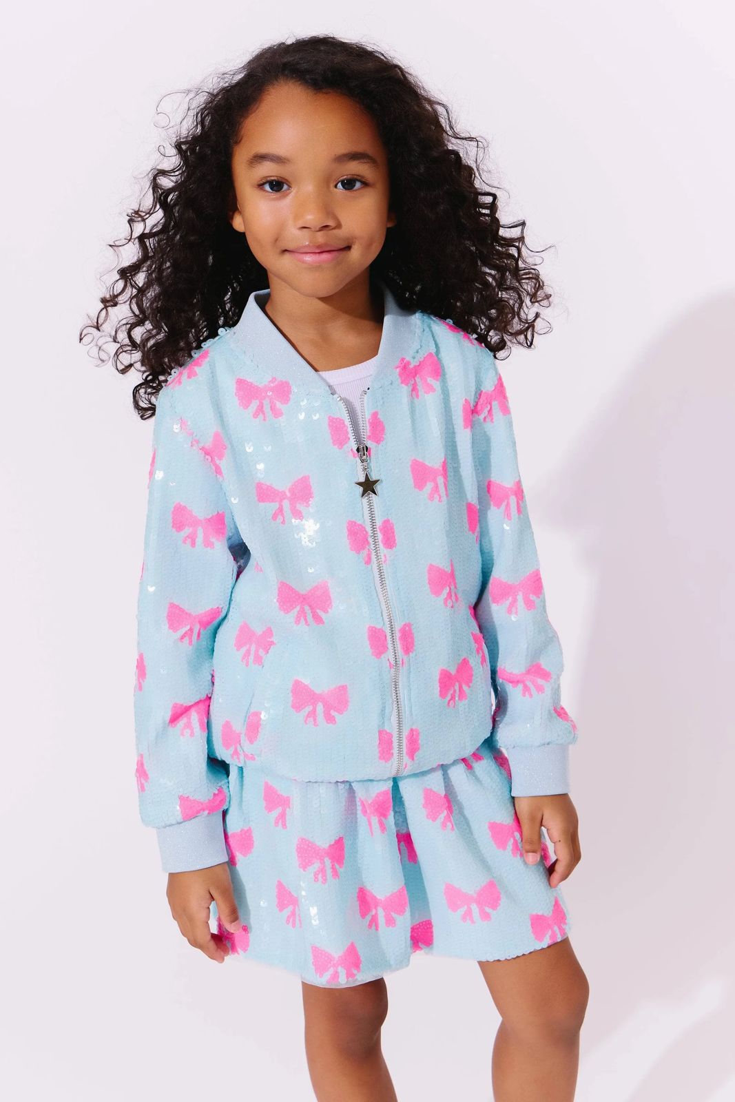 PRETTY IN BOWS SEQUIN BOMBER