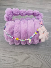 BOLSITA PELUCHE CON CHARMS