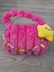 BOLSITA PELUCHE CON CHARMS