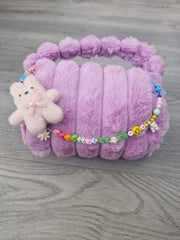 BOLSITA PELUCHE CON CHARMS